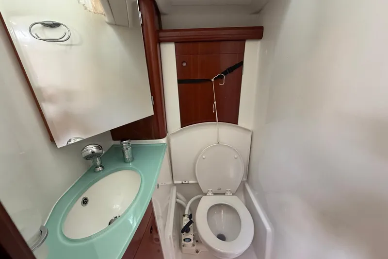 Slide: The Image of Bathroom interior of 2004 Beneteau 57 yacht with sink and toilet. - 73