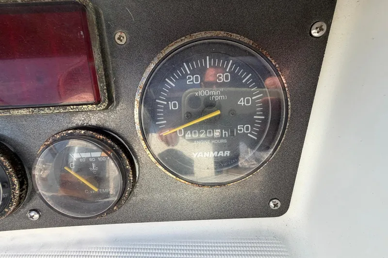 Slide: The Image of Close-up of Beneteau 57 2004 engine gauges, showing RPM and engine hours. - 88