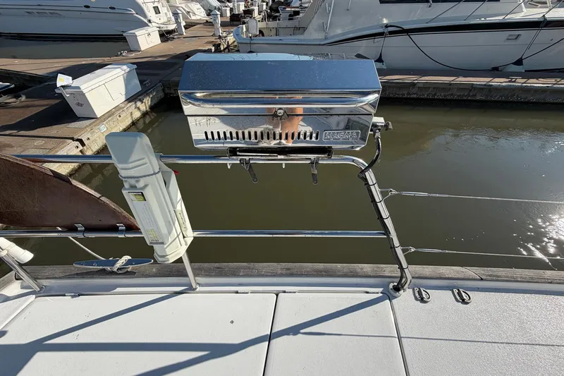 Slide: The Image of Deck of 2004 Beneteau 57 yacht with mounted Magma grill at marina. - 92