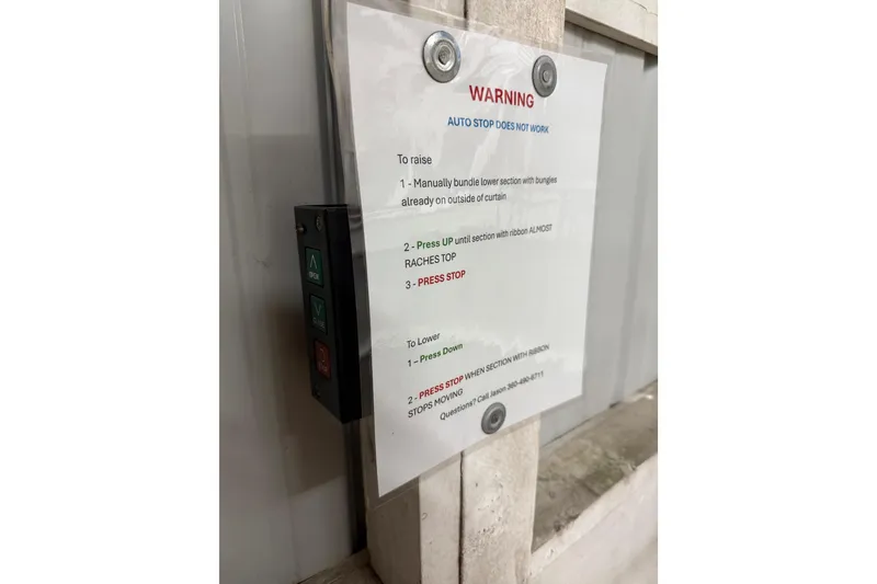 Slide: The Image of Control panel with warning sign about non-functional auto stop on Grand Banks 42 Classic, 1981. - 11