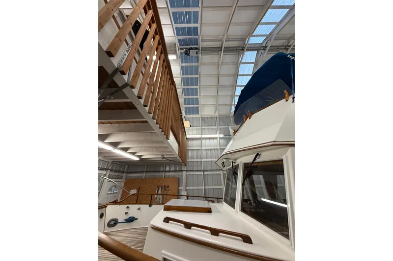 Slide: The Image of 1981 Grand Banks 42 Classic yacht in a spacious indoor storage facility. - 14