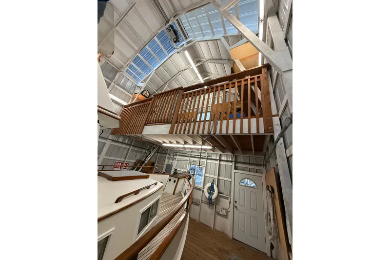 Slide: The Image of 1981 Grand Banks 42 Classic yacht in a spacious indoor storage facility. - 17