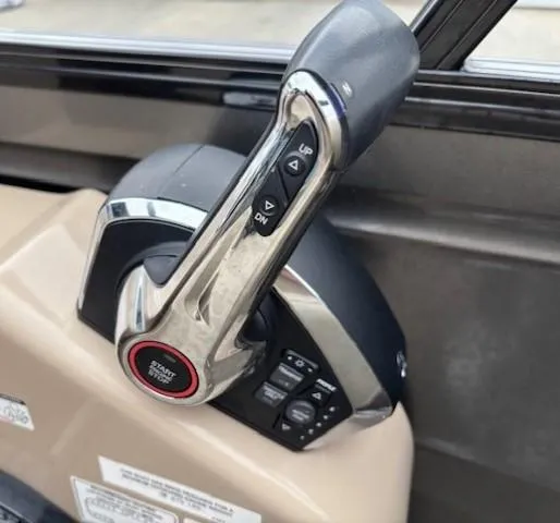 Slide: The Image of 2024 Regency 250 LE3 throttle control with start button and adjustment switches. - 29