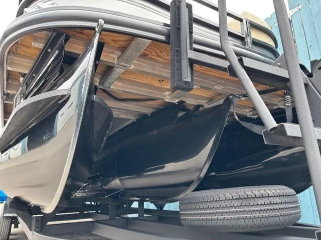 Slide: The Image of 2024 Regency 250 LE3 pontoon boat underside view on trailer. - 3