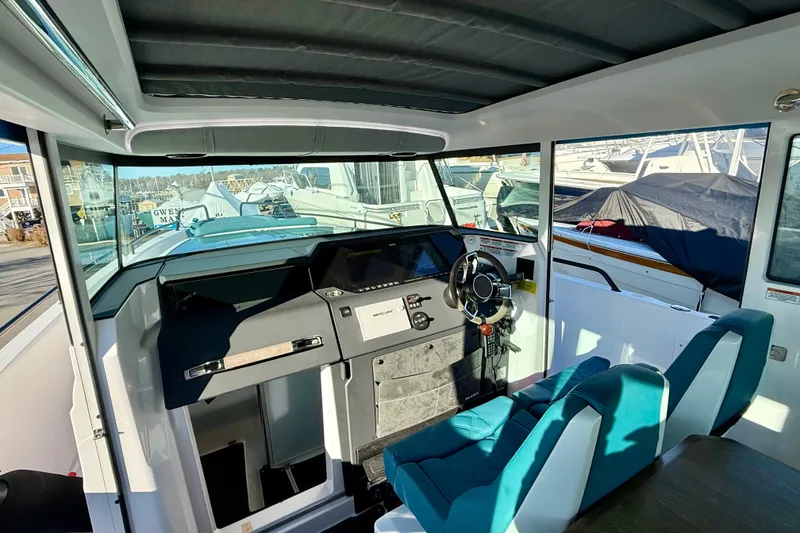 Slide: The Image of Interior view of 2021 Axopar 37 XC Cross Cabin boat with modern helm and seating. - 15