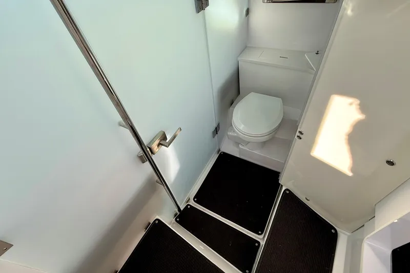 Slide: The Image of Modern bathroom in 2021 Axopar 37 XC CROSS CABIN boat, featuring sleek design and compact layout. - 17