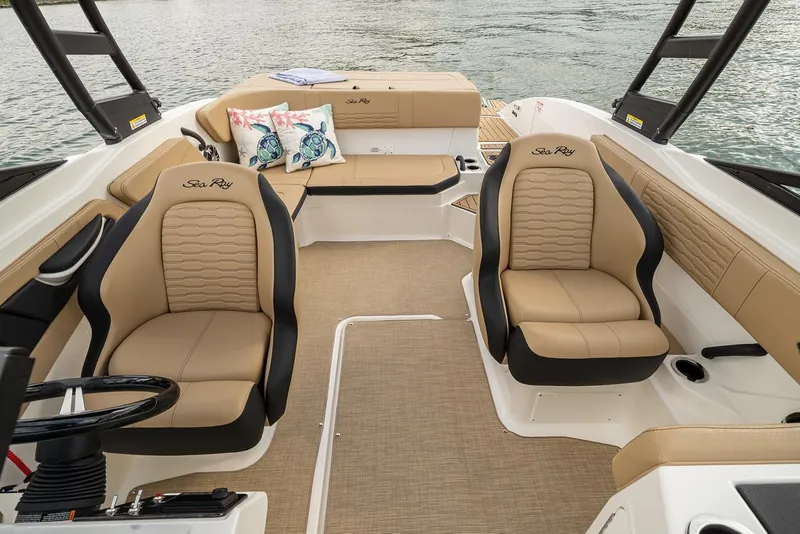 Slide: The Image of Manufacturer Provided Image: 2022 Sea Ray SPX 210 boat interior with tan seating and lake view. - 10
