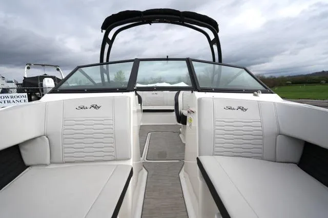 Slide: The Image of 2022 Sea Ray SPX 210 boat interior with white seating and sleek design. - 20