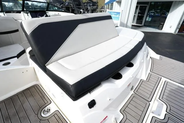 Slide: The Image of 2022 Sea Ray SPX 210 boat with sleek seating and modern deck design. - 26