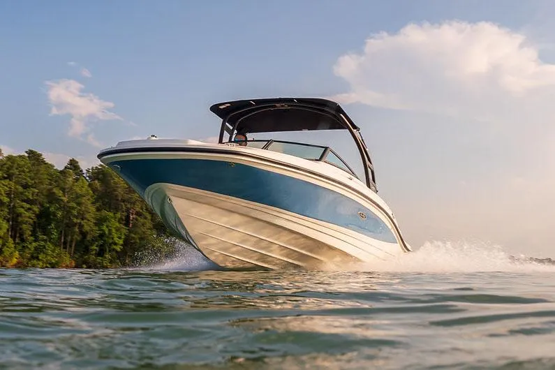 Slide: The Image of Manufacturer Provided Image: 2022 Sea Ray SPX 210 boat cruising on a lake. - 3