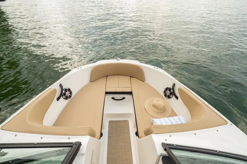 Slide: The Image of Manufacturer Provided Image: 2022 Sea Ray SPX 210 boat interior with tan seating and water view. - 7