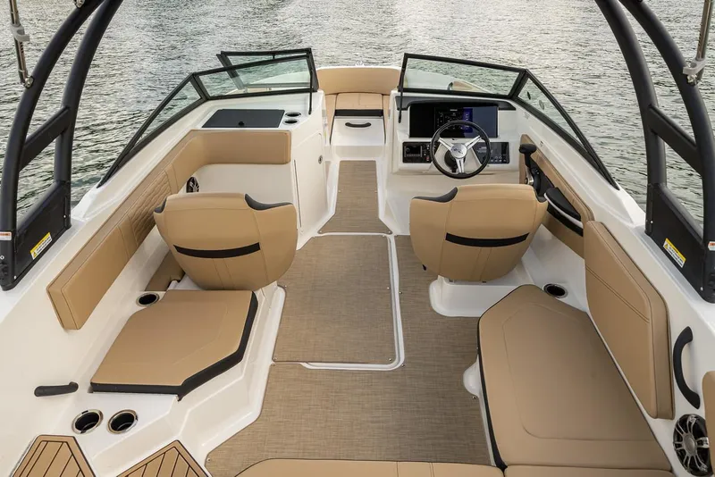 Slide: The Image of Manufacturer Provided Image: 2022 Sea Ray SPX 210 boat interior with tan seating and modern dashboard. - 8