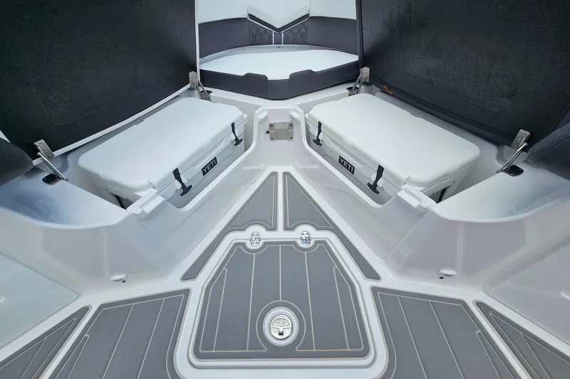 Slide: The Image of 2026 Monterey Elite 30 OB boat interior with Yeti coolers and sleek seating. - 19