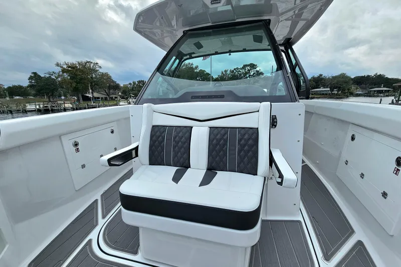 Slide: The Image of 2026 Monterey Elite 30 OB boat interior with luxurious seating and modern design. - 21