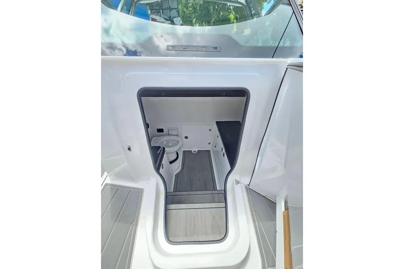 Slide: The Image of 2026 Monterey Elite 30 OB boat interior with compact bathroom and modern design. - 22