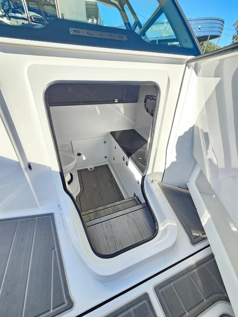 Slide: The Image of 2025 Monterey Elite 30 OB boat interior with modern design and sleek flooring. - 23