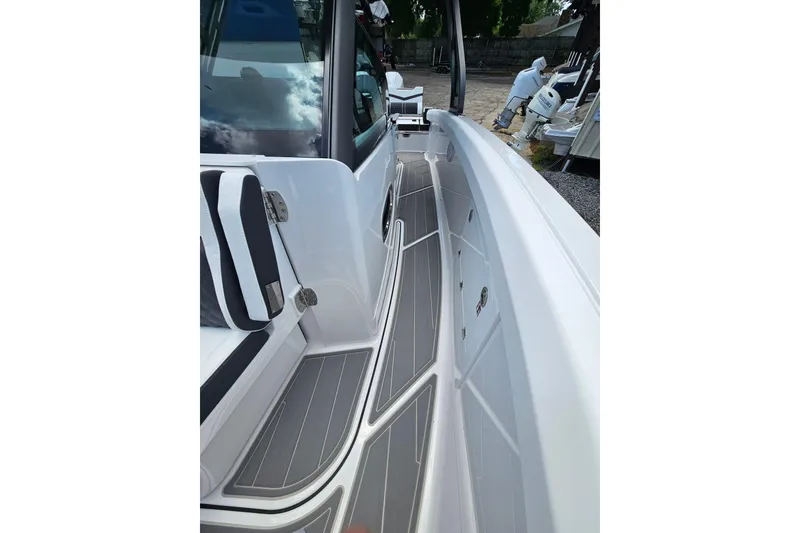 Slide: The Image of 2026 Monterey Elite 30 OB boat interior with sleek seating and modern design. - 30