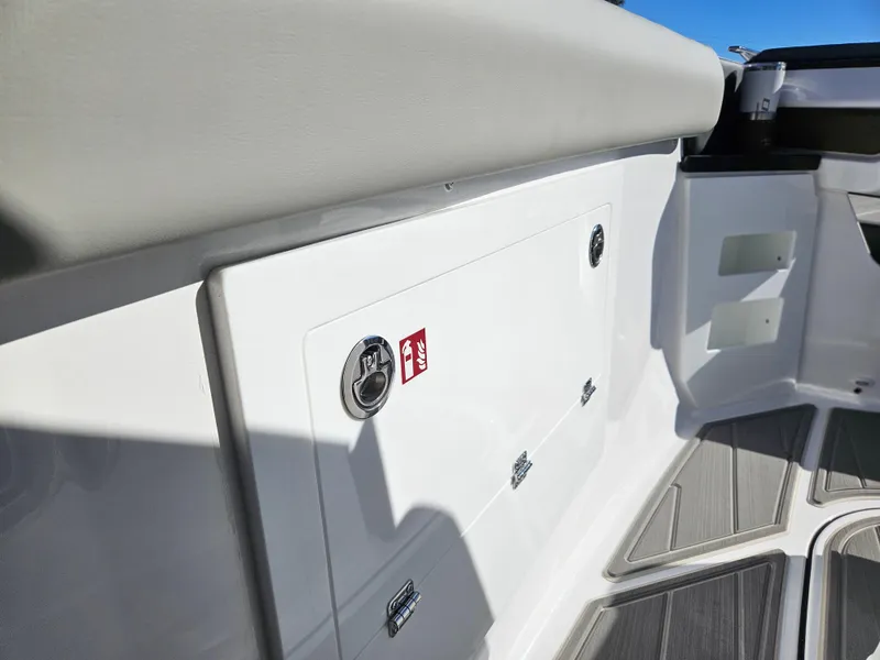 Slide: The Image of 2025 Monterey Elite 30 OB boat interior, featuring sleek white paneling and modern design elements. - 31