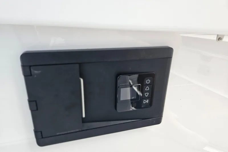 Slide: The Image of Control panel on 2026 Monterey Elite 30 OB boat, featuring a sleek black design. - 33