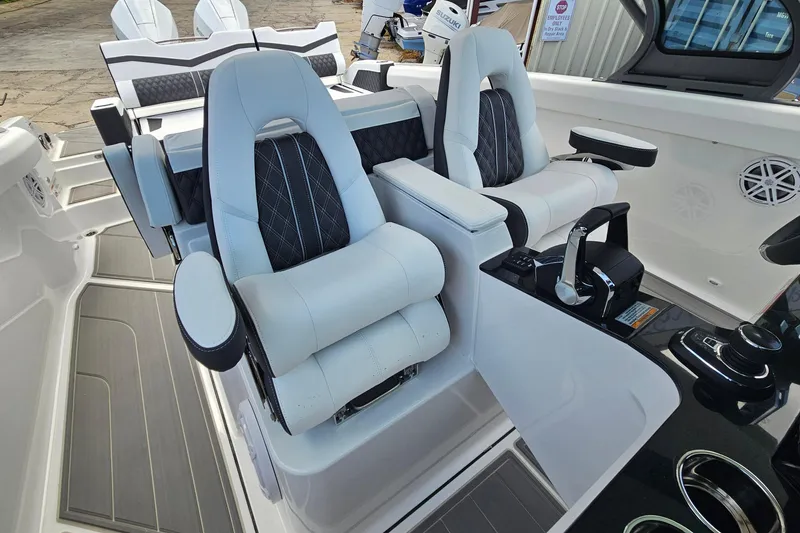 Slide: The Image of Luxury seating and controls in 2026 Monterey Elite 30 OB boat cockpit. - 35