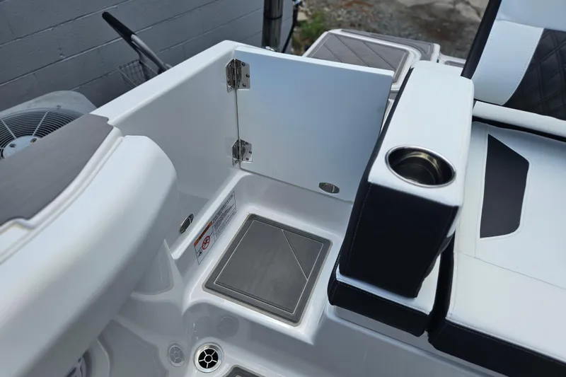 Slide: The Image of 2026 Monterey Elite 30 OB boat interior with seating and storage compartment. - 36