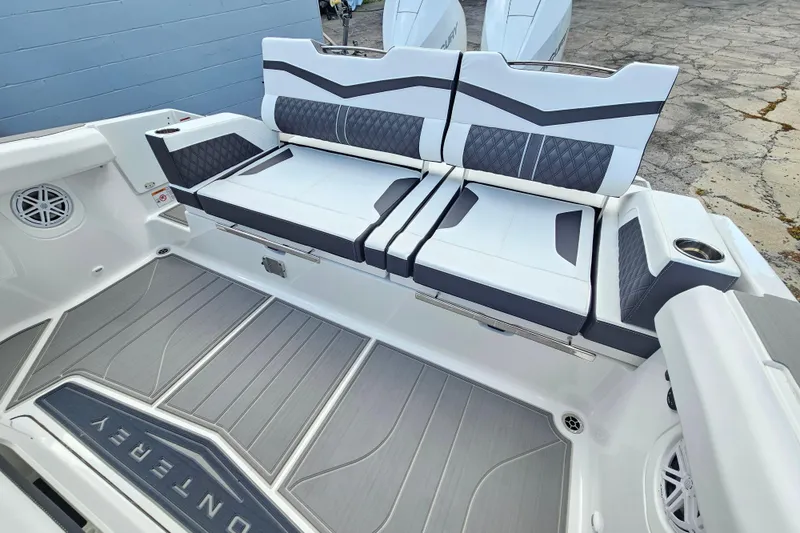 Slide: The Image of 2026 Monterey Elite 30 OB boat interior with stylish seating and modern design. - 6