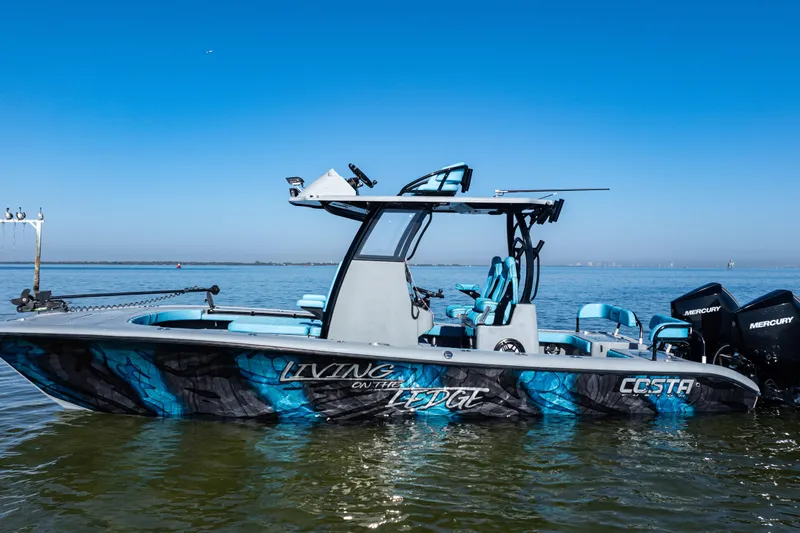 The Image of 2022 Costa Custom Boats 264 on water, featuring "Living on the Edge" design. - 0