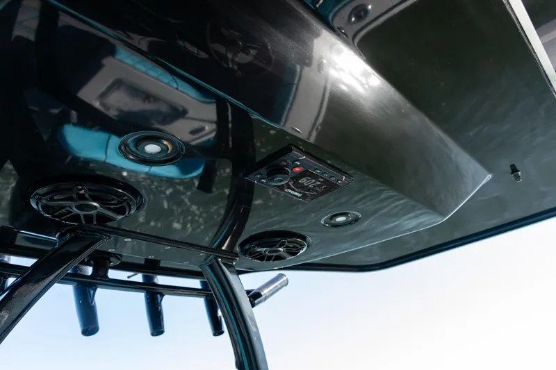 Slide: The Image of 2022 Costa Custom Boats 264, featuring sleek audio system and modern design elements. - 27