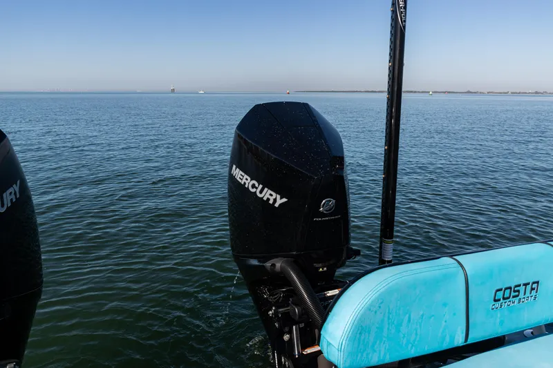 Slide: The Image of 2022 Costa Custom Boats 264 with Mercury engine on calm water. - 32
