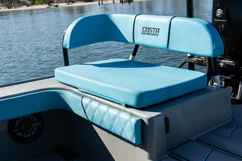 Slide: The Image of Blue seating on 2022 Costa Custom Boats 264, near water. - 33