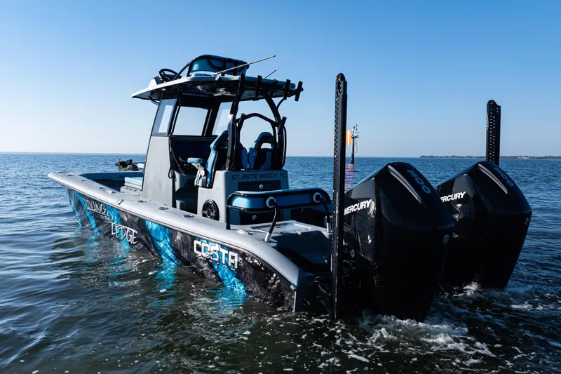 Slide: The Image of 2022 Costa Custom Boats 264 on water, featuring dual Mercury engines. - 4