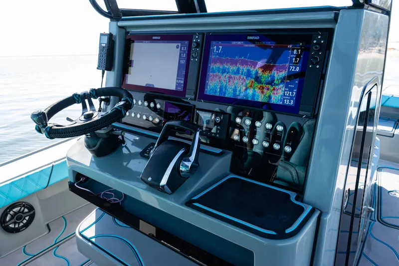 Slide: The Image of Helm of 2022 Costa Custom Boats 264 with advanced navigation displays and controls. - 47