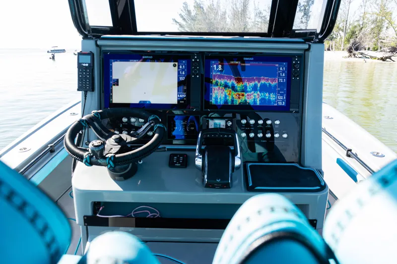 Slide: The Image of Cockpit of 2022 Costa Custom Boats 264 with advanced navigation and control systems. - 48