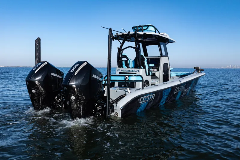 Slide: The Image of 2022 Costa Custom Boats 264 on water, featuring dual Mercury engines. - 51
