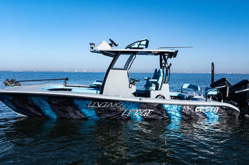 Slide: The Image of 2022 Costa Custom Boats 264 on water, vibrant design, clear blue sky background. - 52