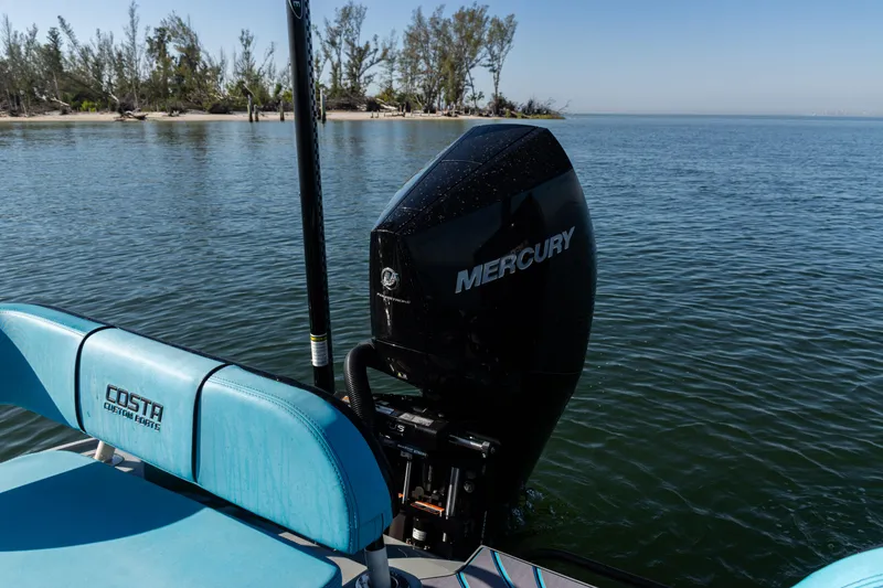 Slide: The Image of 2022 Costa Custom Boats 264 with Mercury engine on calm water. - 55