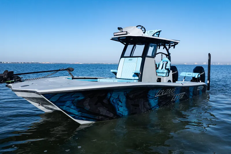 Slide: The Image of 2022 Costa Custom Boats 264 on water, featuring sleek design and vibrant graphics. - 6