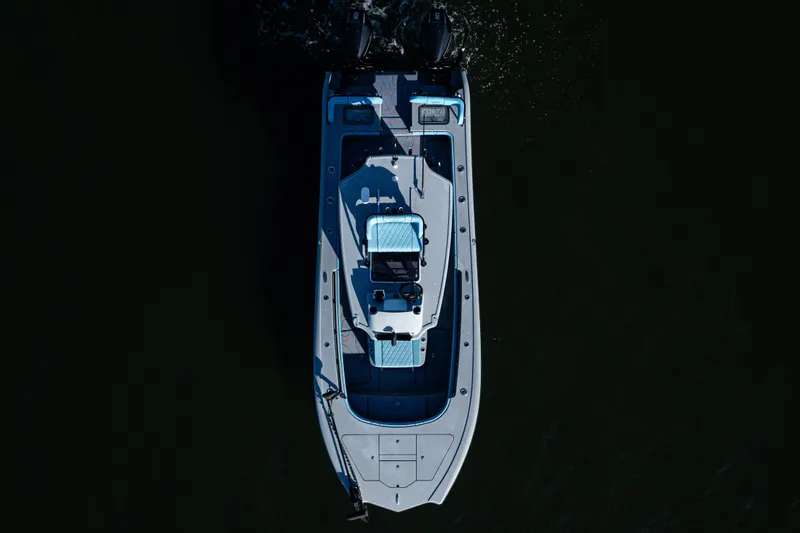 Slide: The Image of Overhead view of 2022 Costa Custom Boats 264 on dark water. - 9