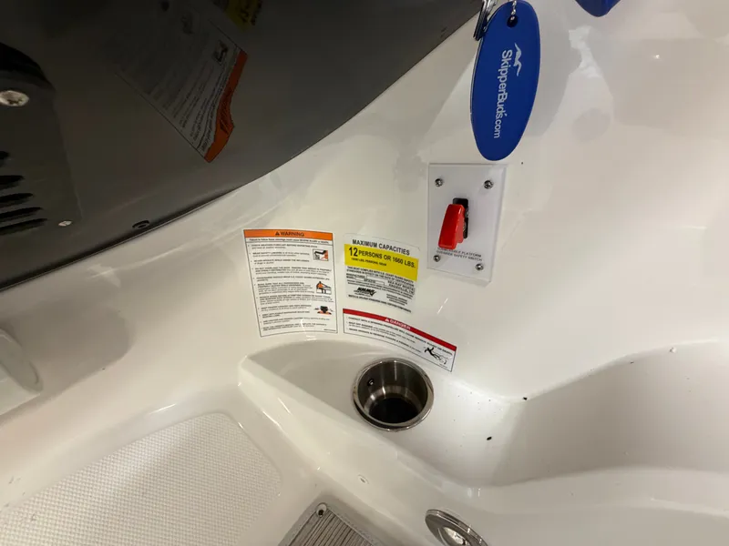 Slide: The Image of 2026 Sea Ray SPX 210 boat interior with safety labels. - 26