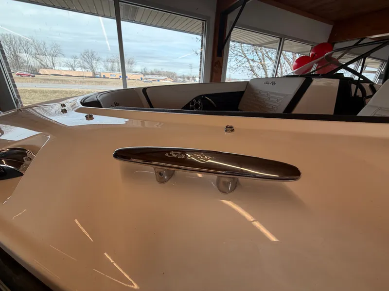 Slide: The Image of 2026 Sea Ray SPX 210 boat in showroom. - 36