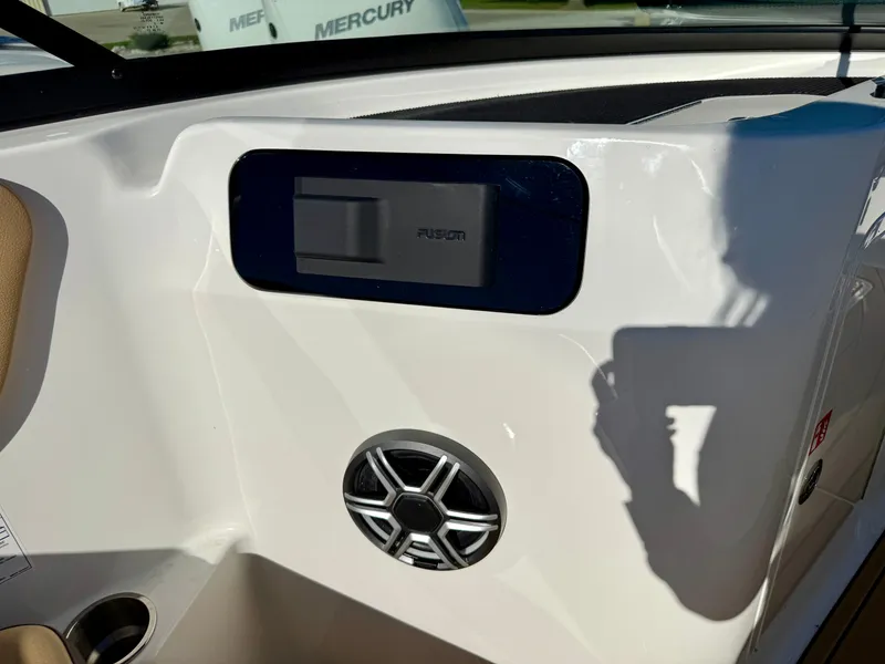 Slide: The Image of Close-up of a speaker and control panel on a Sea Ray SDX 230 boat. - 25