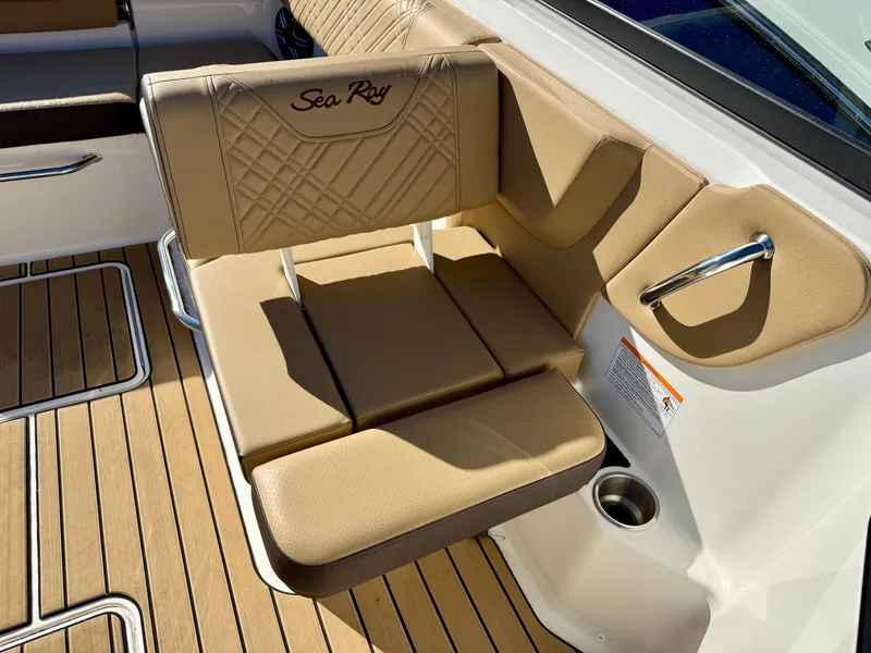 Slide: The Image of Beige seat with 'Sea Ray' logo on a boat, surrounded by wood-patterned flooring. - 7