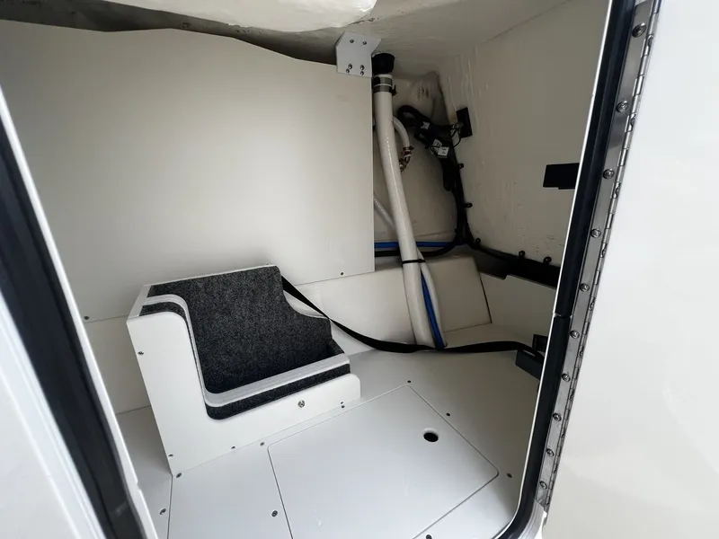 Slide: The Image of Interior of a 2026 Sea Ray SDX 250 with seating and storage space. - 19