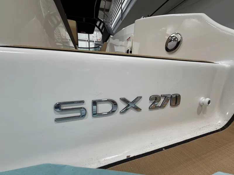 Slide: The Image of Sea Ray SDX 270 boat, model year 2026, close-up view. - 12