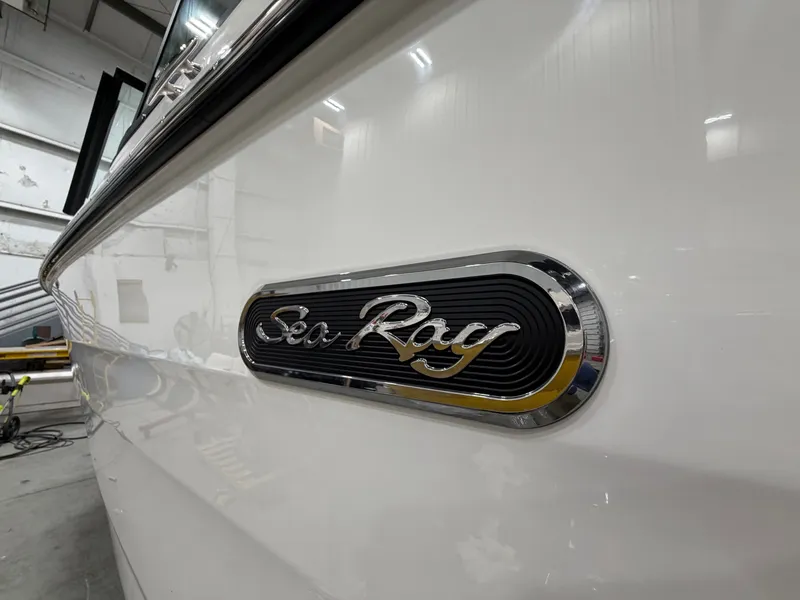 Slide: The Image of Sea Ray SDX 270 boat 2026, close-up of logo. - 14