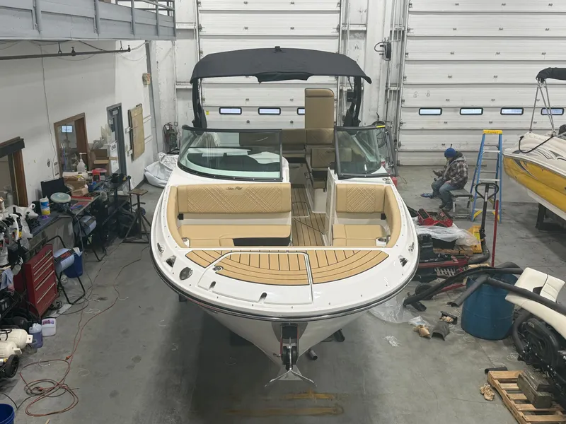 Slide: The Image of 2026 Sea Ray SDX 270 boat in a workshop. - 15