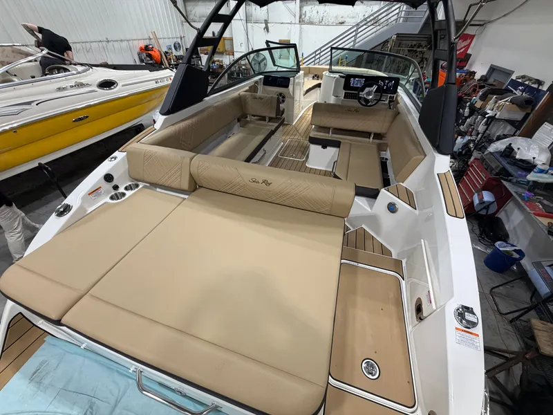 Slide: The Image of Interior view of a 2026 Sea Ray SDX 270 boat in a workshop. - 18