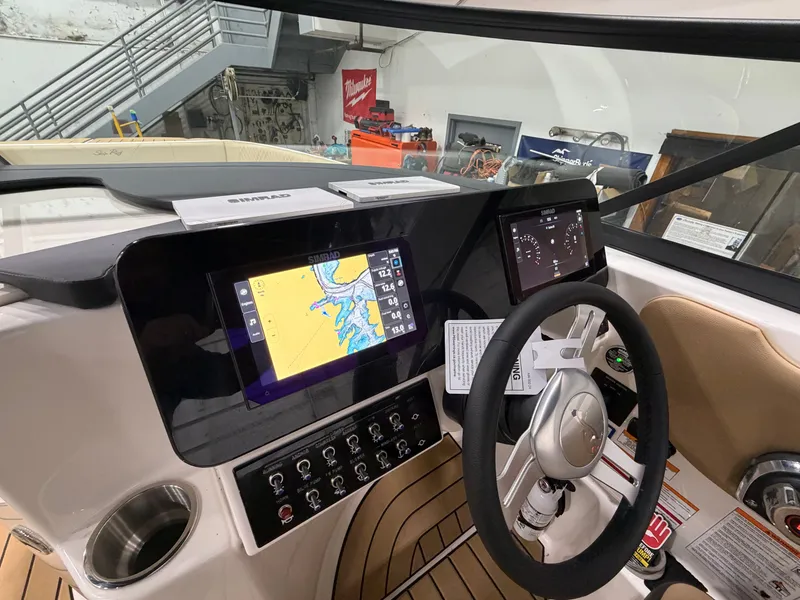 Slide: The Image of Interior view of 2026 Sea Ray SDX 270 helm with navigation system. - 22
