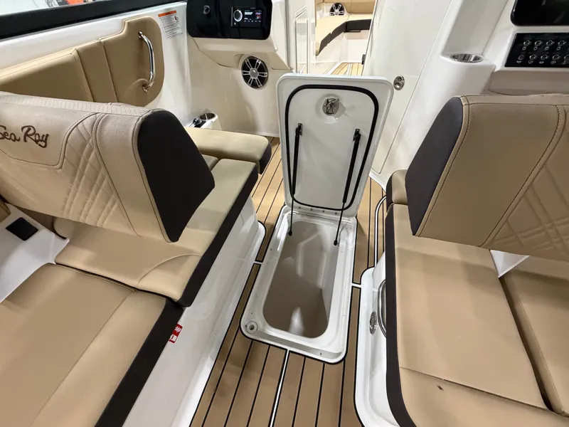 Slide: The Image of Interior of 2026 Sea Ray SDX 270 with open storage compartment. - 26