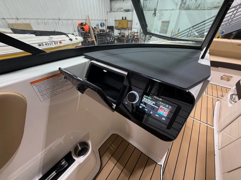 Slide: The Image of Interior view of 2026 Sea Ray SDX 270 with modern helm console. - 28